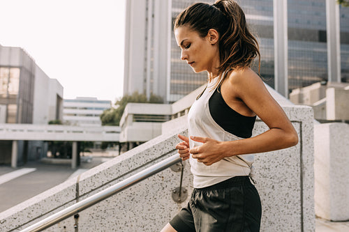 Sporty woman exercising in the city