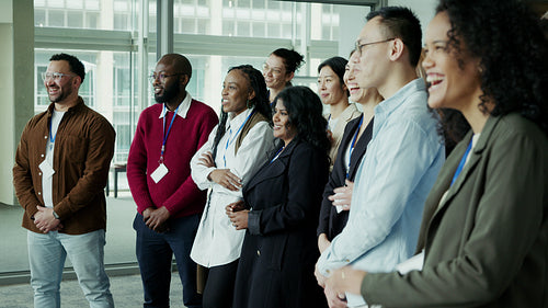 Diverse group smiling and applauding