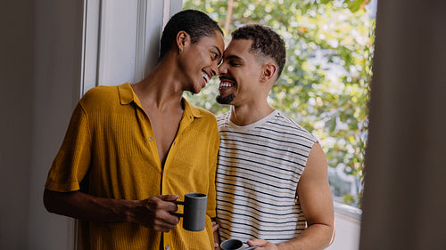 Happy couple enjoying time together at home on a sunny day