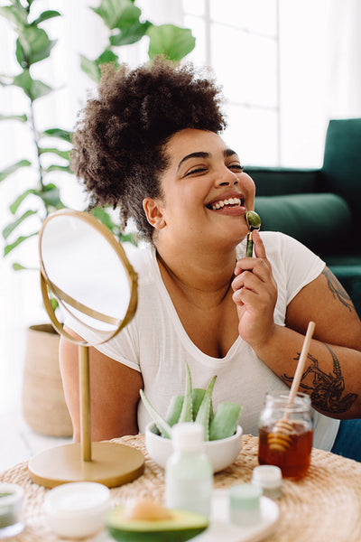 Woman taking skin care at home