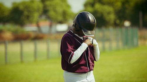 Young baseball player prepares for the game