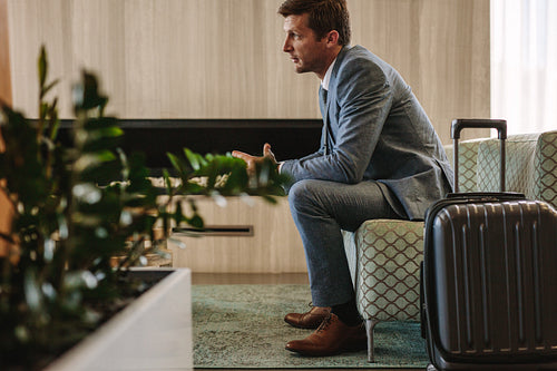 Businessman eagerly waiting for this flight