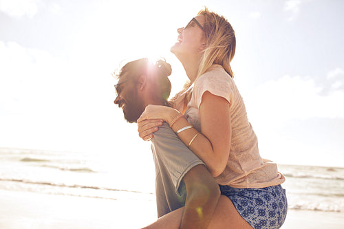 Young couple having fun at the beach
