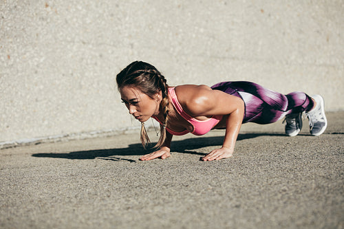 Fitness woman doing core exercise in morning