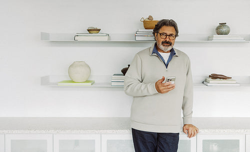 Calling senior talks on a smartphone at home