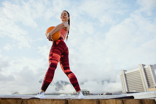 Fitness woman with basketball