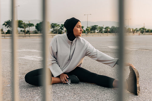 Young Muslim woman working out in the city