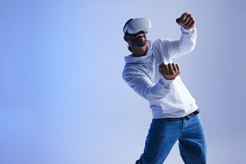 Cheerful young man driving in a 3D video game