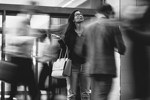Businesswoman waiting for someone in a busy lobby