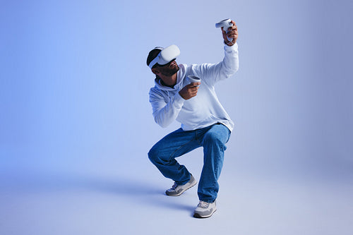 Gamer exploring virtual reality video games in a studio