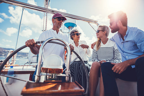 Group of people hanging out together on a sailboat
