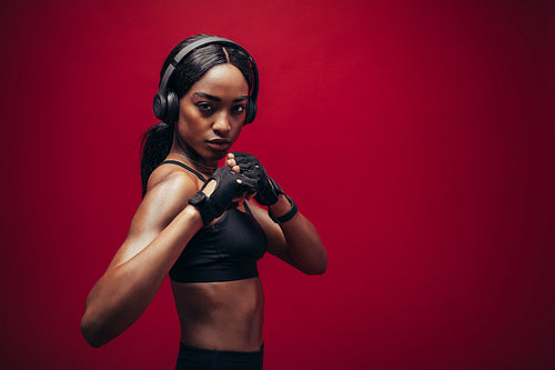 Female boxer with fighting stance 