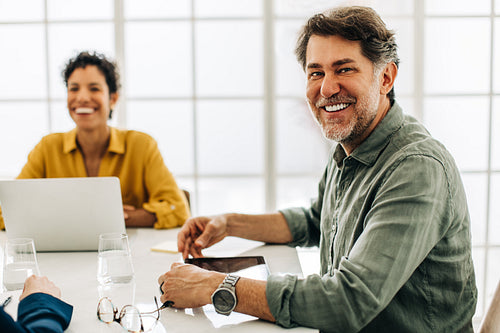 Professional business man having a meeting with his team in an office