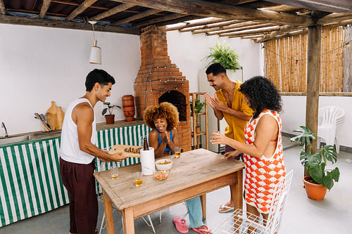 Group of friends enjoying petiscos during a relaxed weekend gathering in Rio