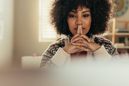 Thoughtful womam at her desk