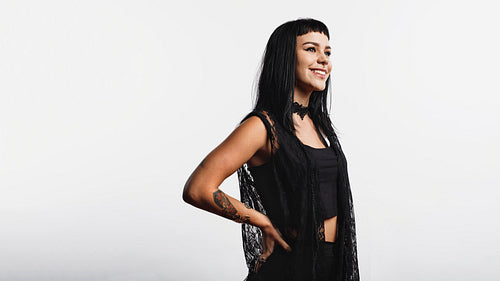Smiling woman with tattoo and piercings