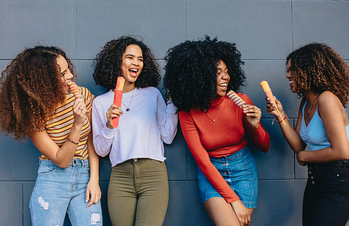 Young buddies eating ice cream