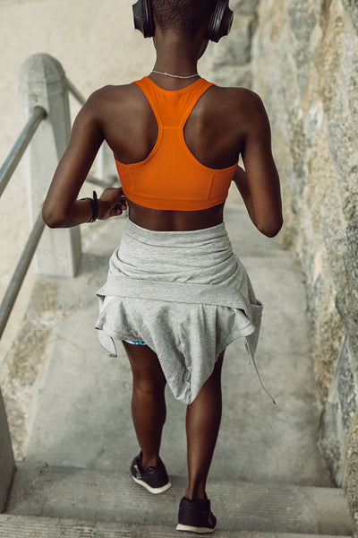 Fitness woman running down the steps