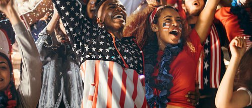 Group of American soccer fans celebrating victory