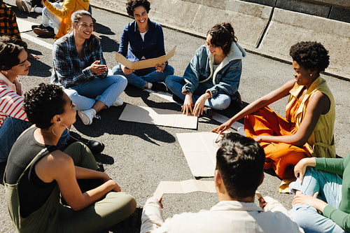 Group of supportive protestors gathered in discussion during an outdoor demonstration