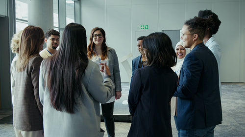 Diverse business professionals engaging in a lively discussion at a conference event