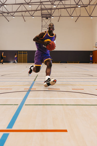 Basketball player running with the ball