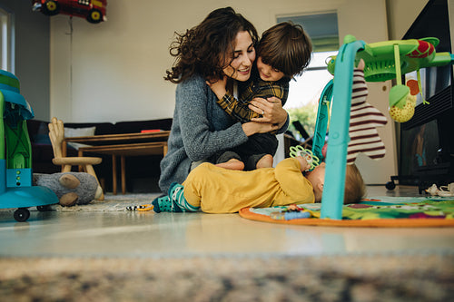 Woman having fun with kids while on maternity leave