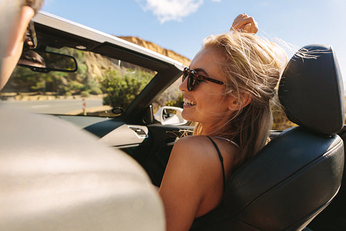 Woman with her boyfriend enjoying on a roadtrip
