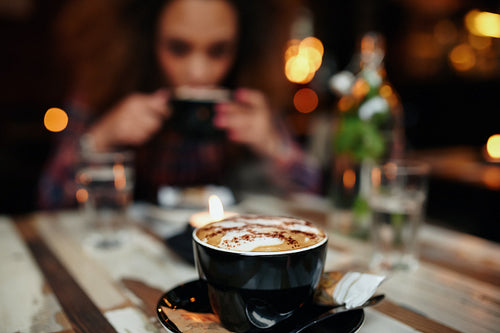 Cup of coffee on table at cafe