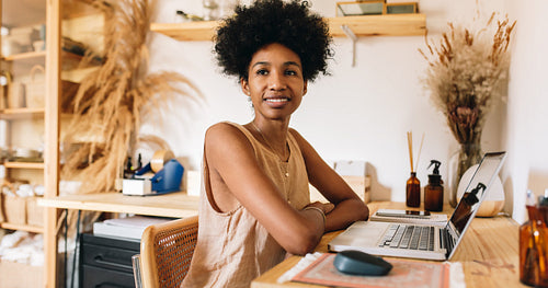 Ornament artist at her office desk