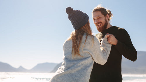 Couple enjoying on a beach on a sunny day