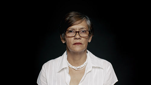 Happy senior woman in eyeglasses