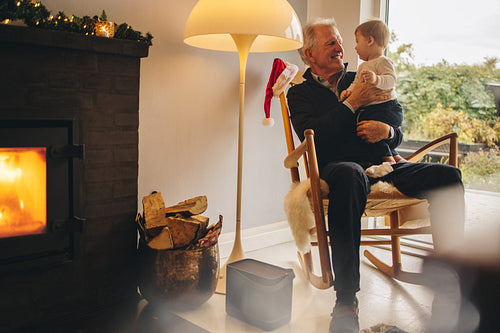 Senior man with grandson on christmas eve