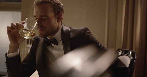 Handsome guy having a drink at a party