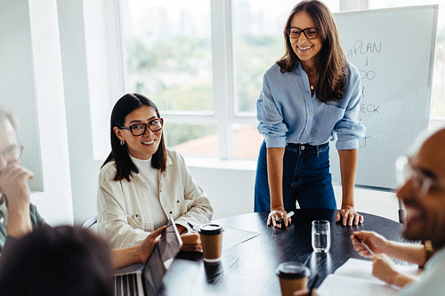 Woman discussing a new project with her team in a meeting