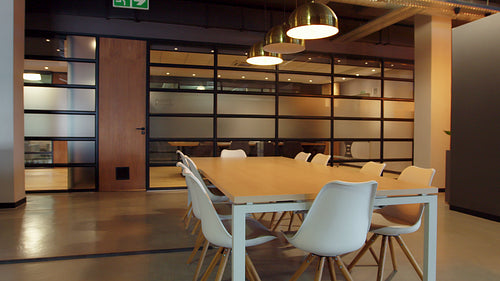 Empty conference area with a table and chairs in an office