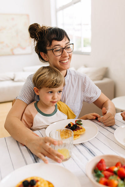 Mother and son having breakfast