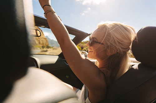 Beautiful woman enjoying on a road trip