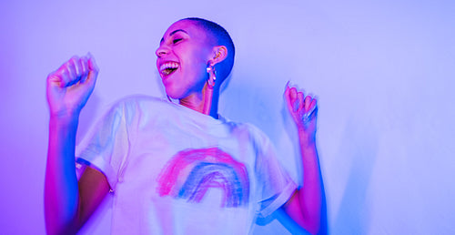 Craefree young woman dancing joyfully at a party