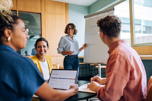 Team discussing strategies during a meeting in a modern office setting
