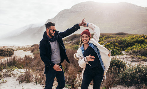 Couple dancing together on trip