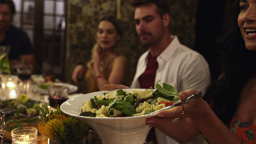 Friends having food together at a party