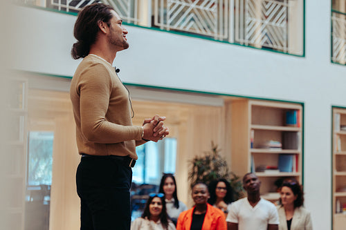 Confident speaker delivers engaging presentation to a diverse audience