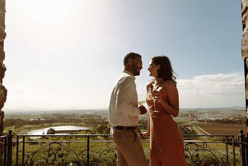 Couple drinking wine at a farmhouse