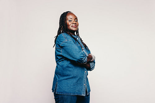 Stylish mature woman looking at the camera in a studio