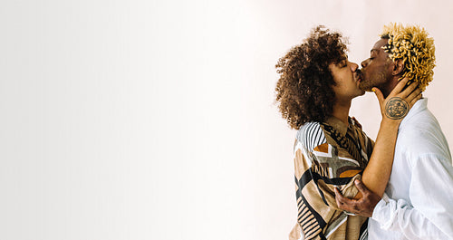 Intimate gay couple kissing passionately