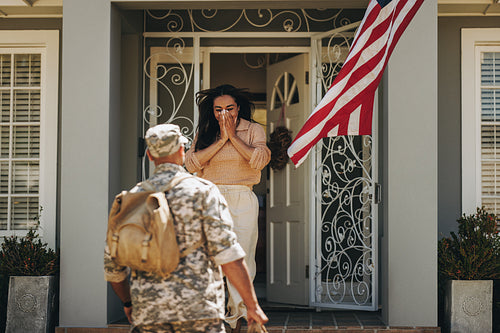 Army soldier surprising his wife with his homecoming