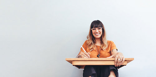 Portrait of a freelance illustrator at work