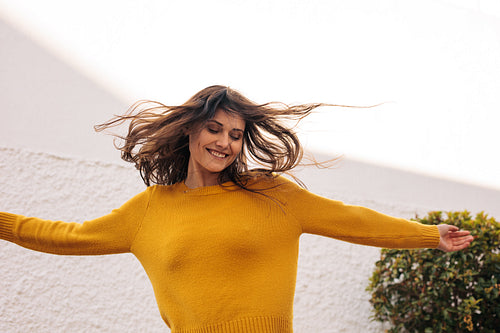 Pretty woman dancing outdoors