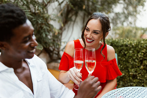 Happy young couple toasting with sparkling wine